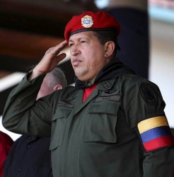 Venezuela's President Chavez salutes during a military parade to celebrate the 16th anniversary of a failed coup d'etat led by him in 1992, in Valencia